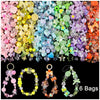 A collection of colorful acrylic beads and stringing material for DIY jewelry making, including several finished bags.