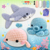 A beginner crochet kit for amigurumi animals featuring a purple shark, blue elephant, and pink whale.