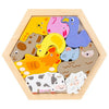 A wooden jigsaw puzzle featuring various colorful animal figures like a duck, a pig, a sheep, and a cat.