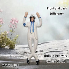 A light beige plush doll standing on a snowy surface, showing the front and back views.