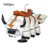 A large white and orange building block model of a flying bison creature.
