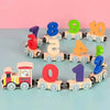 A set of magnetic wooden number train cars showing numbers 1 through 10 in various colors.