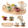 A wooden pretend play tea party set featuring various cups and a teapot on a wooden serving tray.