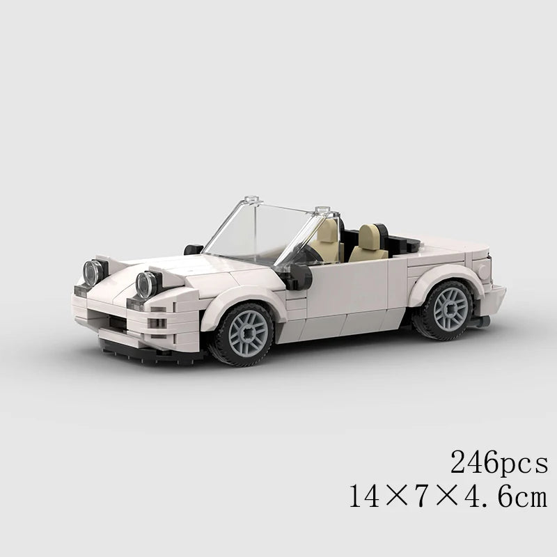 A white classic rally car model built from building blocks, shown in a side view.