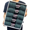 A box displaying a 5-pack of teal alpaca wool yarn skeins for knitting and crochet.