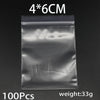 A package containing 100 clear resealable plastic bags measuring 4x6cm each, with a total weight of 33g.