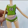 A doll fashion set featuring a green top with the number 01 and matching striped bottoms.