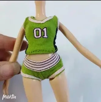 A doll fashion set featuring a green top with the number 01 and matching striped bottoms.