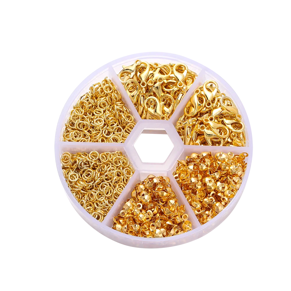 A circular display of gold jewelry making components including lobster clasps, jump rings, and crimps.