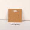 A rectangular brown kraft card with a die-cut slot and two small openings for jewelry display.