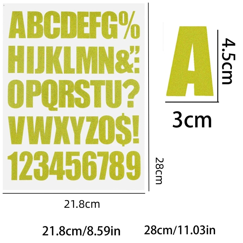 A sheet of DIY iron-on heat transfer patches showing the alphabet and numbers in a light yellow color with size indicators.