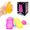 A hand holds a bright yellow squishy toy, with other pink and yellow squishy toys displayed nearby.
