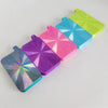 A collection of six iridescent diamond painting trays in various bright colors, arranged diagonally on a white surface.