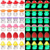 A collection of glow-in-the-dark resin miniature mushrooms in various colors and shapes for fairy garden décor.