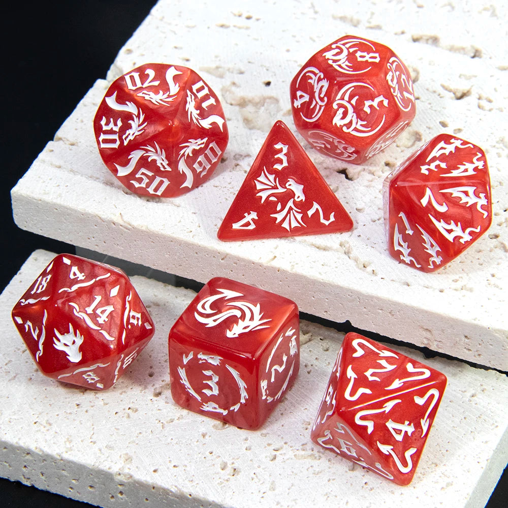 A set of red marble dragon pattern polyhedral dice displayed on a white textured surface.