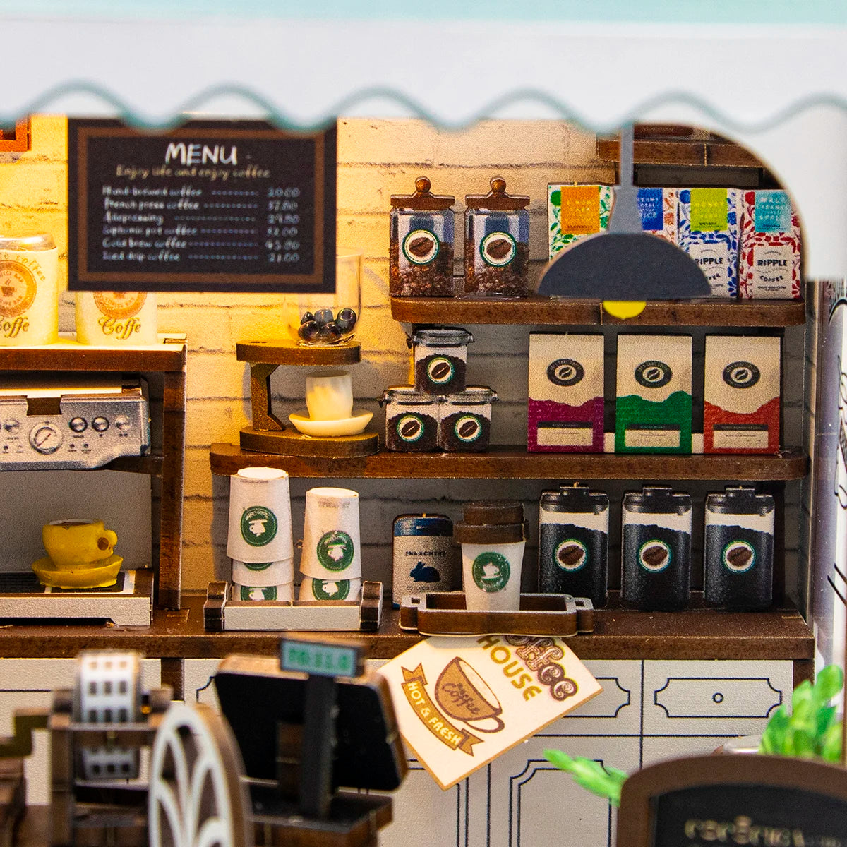 A detailed miniature wooden dollhouse kit of a coffee shop featuring shelves, cups, and brewing equipment.