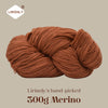A ball of reddish-brown Merino wool yarn labeled as Lirisnly's hand-picked 300g Merino.