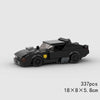 A black classic rally car model built from LEGO bricks.