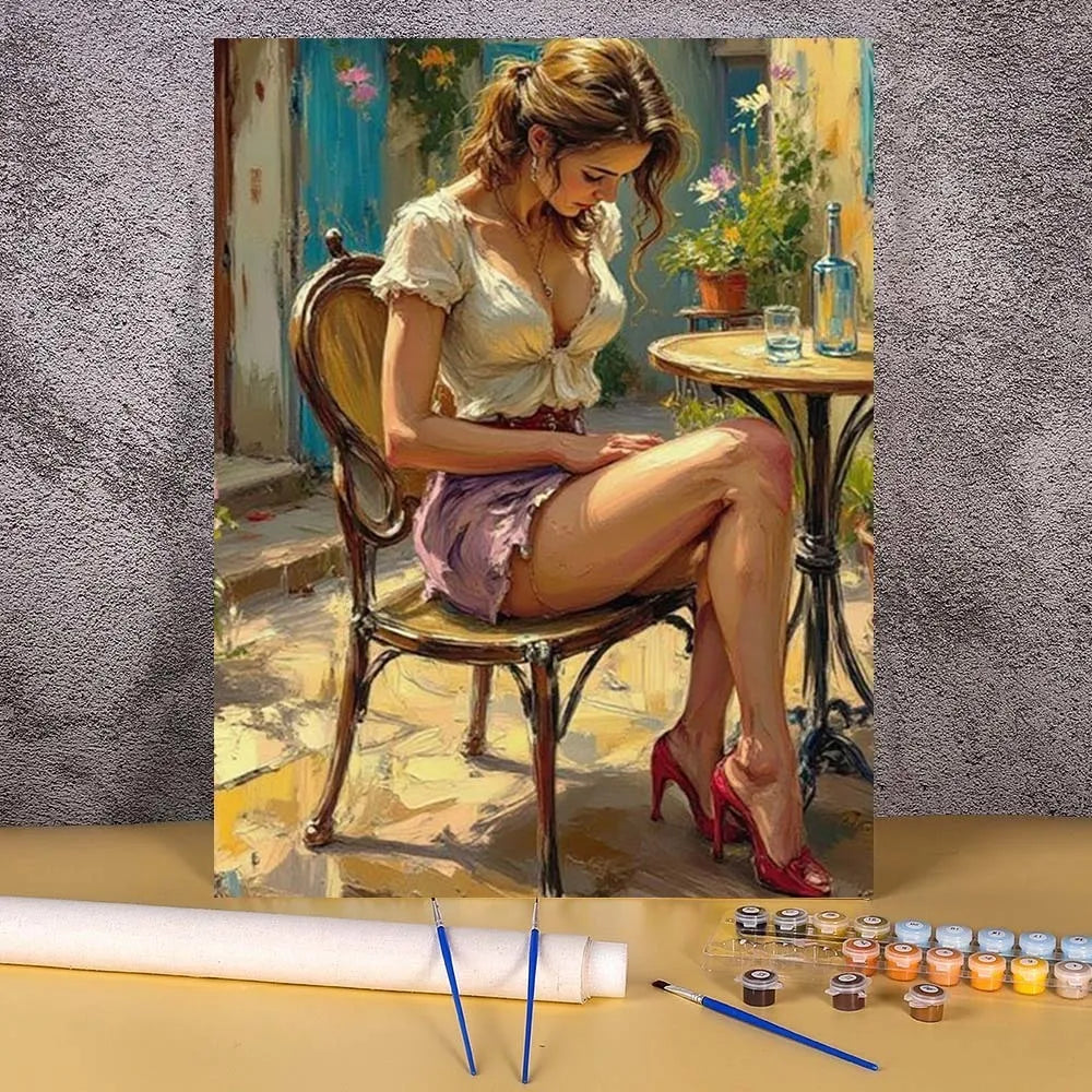 A painting by numbers kit featuring an elegant woman portrait, painted in soft yellows and greens.