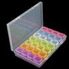 A clear plastic storage box for diamond painting supplies with multiple colored organizer trays.