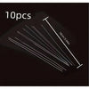 A set of ten ultra-fine metal beading needles for jewelry making shown at an angle against a dark background.