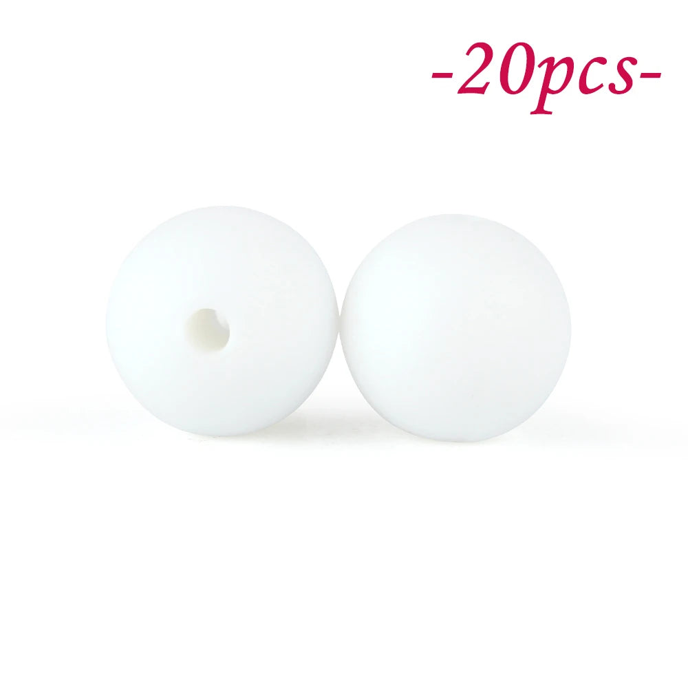 Two white soft silicone beads are shown against a white background.