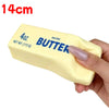 A hand holds a yellow butter stick squishy toy labeled 4oz salted butter.