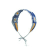 A handmade strawberry crochet headband featuring blue and orange yarn with a wide elastic band.