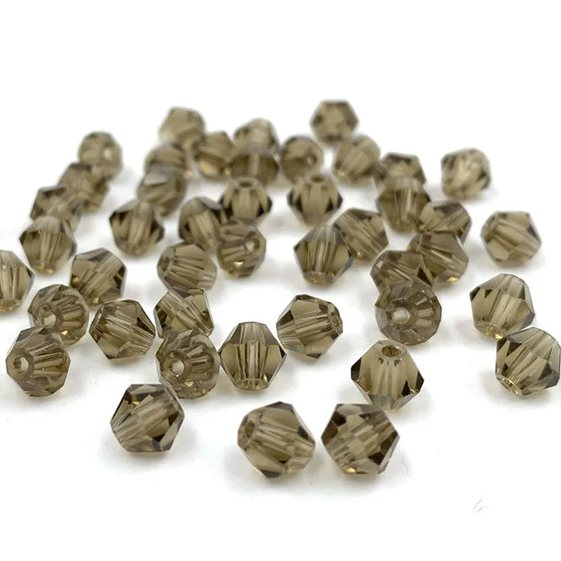 A pile of faceted bicone crystal glass beads for jewelry making