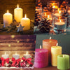 A collection of glowing candles in various colors and sizes set against a rustic wooden background.
