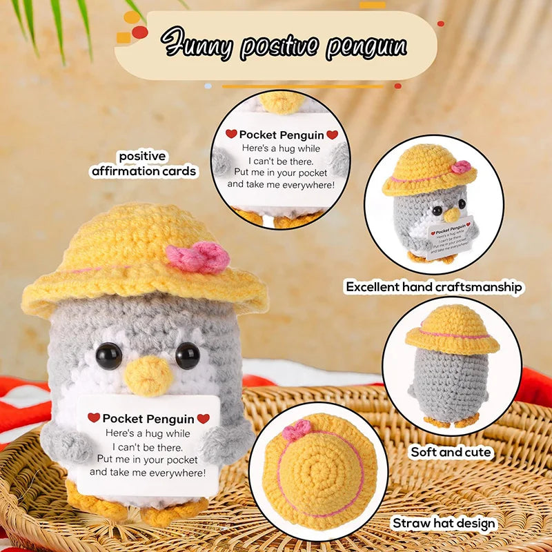 Handmade crochet penguin doll with a straw hat and a positive affirmation card