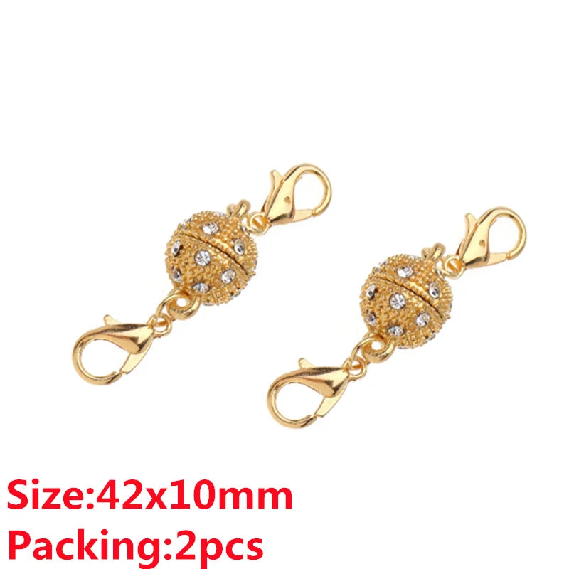 A pair of gold-colored magnetic clasps for jewelry making, featuring decorative textured metal connectors.