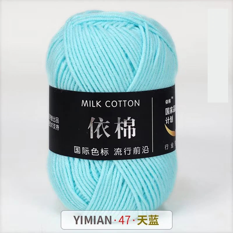 A ball of light blue milk cotton yarn labeled with Chinese characters and a YIMIAN brand mark.