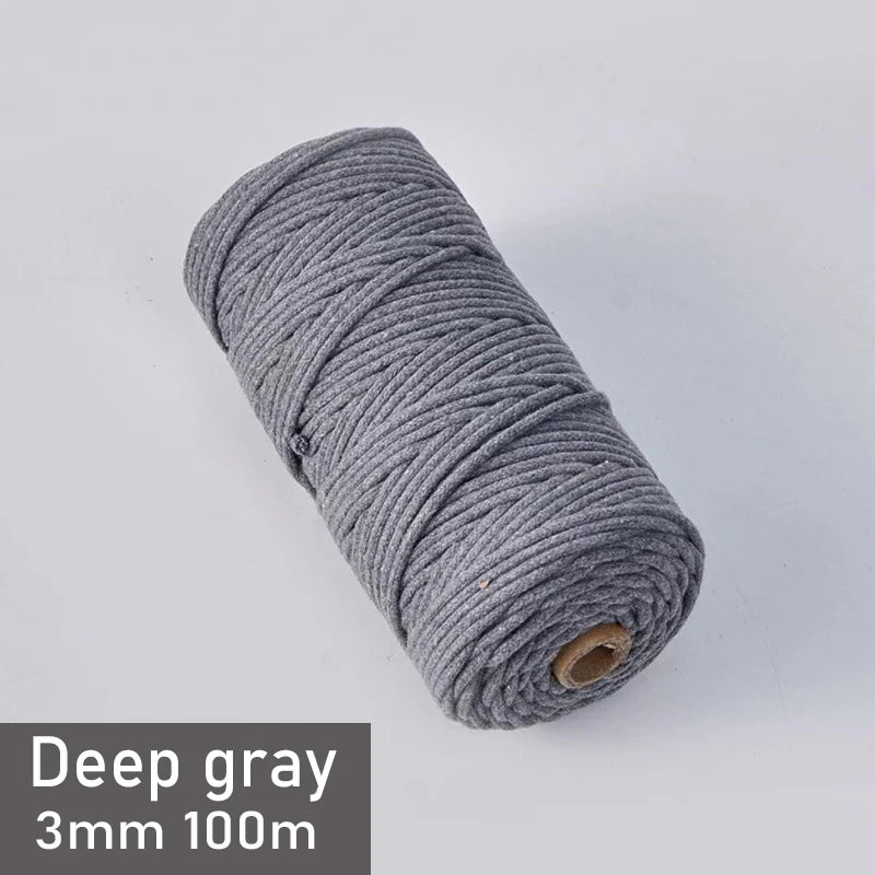 A spool of deep gray 3mm cotton macrame cord measuring 100 meters.
