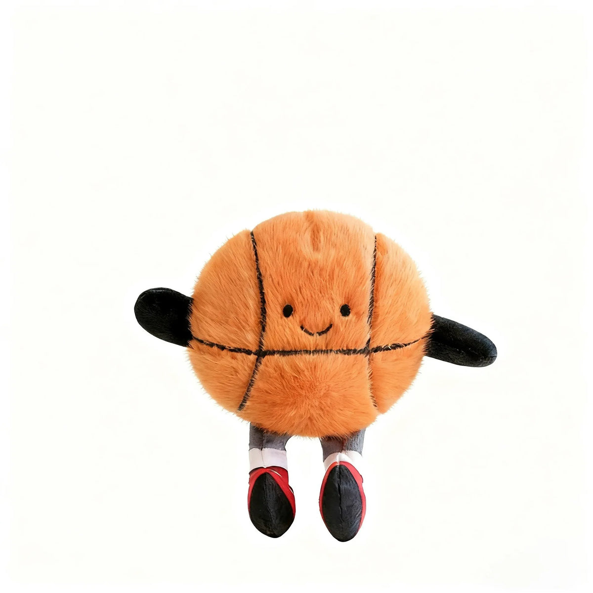 An orange plush sports ball with black accents and feet, resembling a mini basketball or soccer ball.