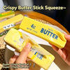 A hand holds a yellow butter stick squeeze toy with a crispy surface texture.