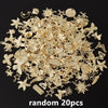 A pile of random gold-colored metal charms for DIY jewelry making