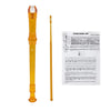 An orange 8-hole soprano recorder with a cleaning rod and a fingering chart.