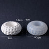 Two white silicone molds with dimpled patterns shown next to each other, indicating their size.