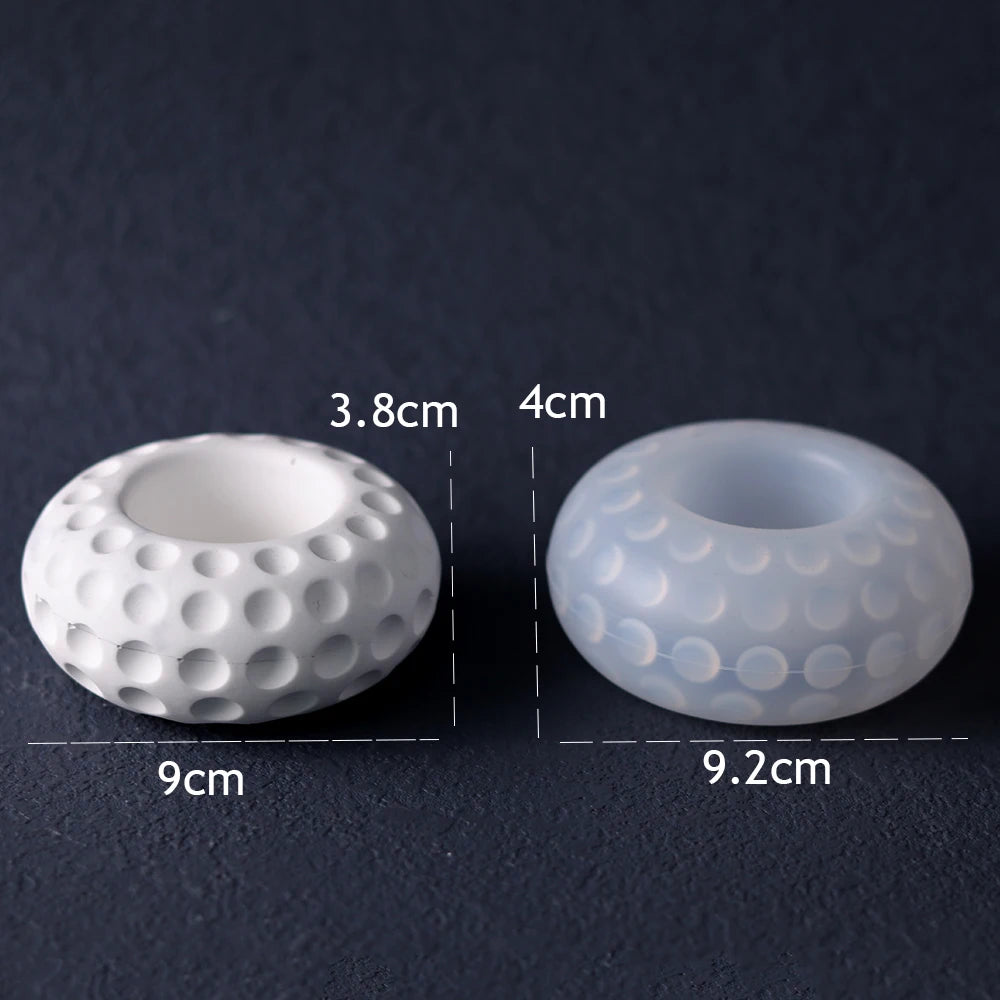 Two white silicone molds with dimpled patterns shown next to each other, indicating their size.