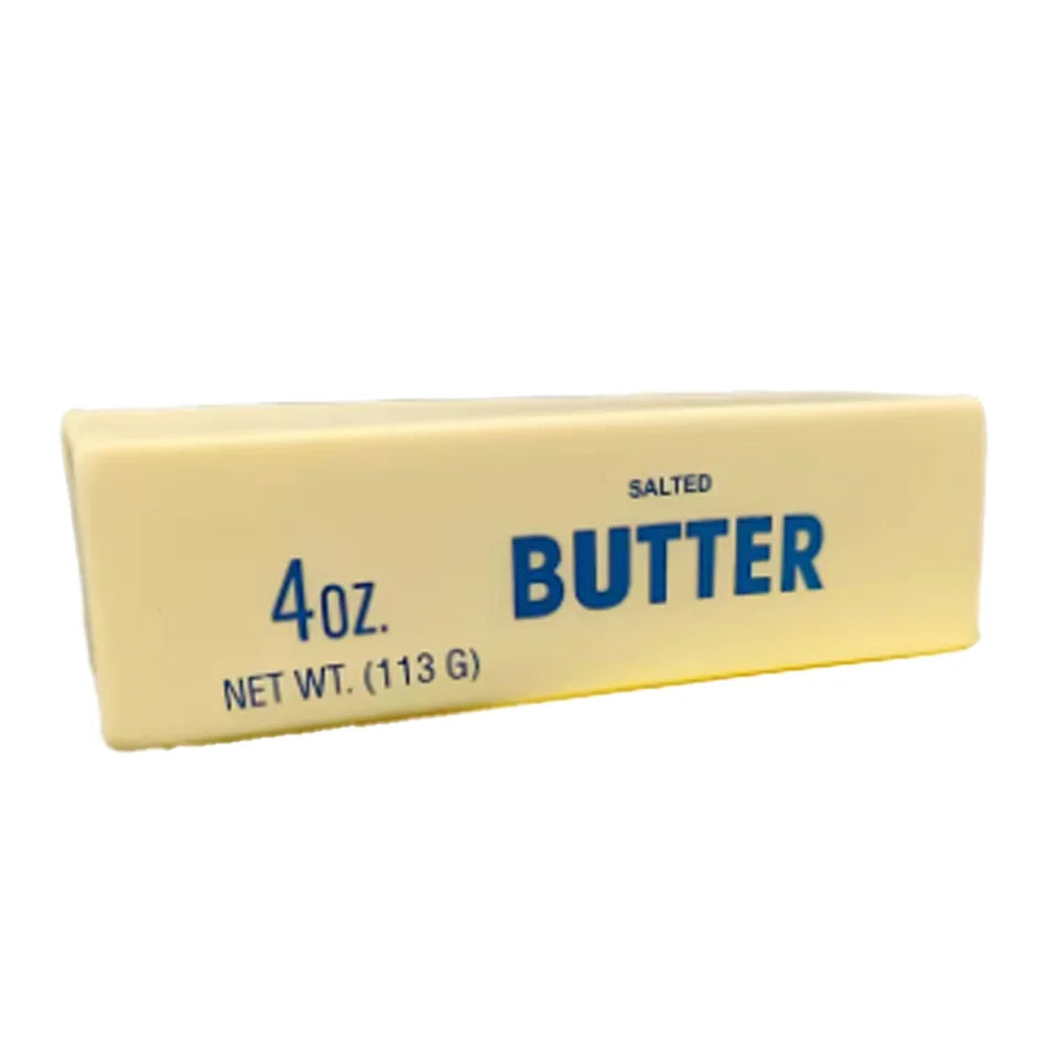 A rectangular block of salted butter labeled 4oz net wt 113 g