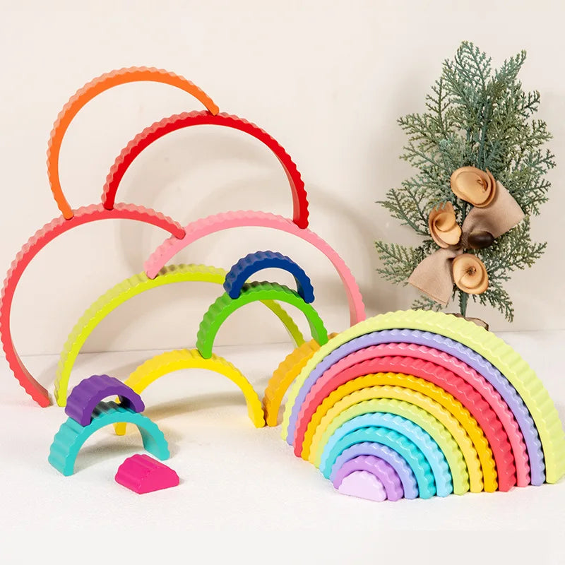 A set of colorful rainbow arch stack blocks for Montessori play