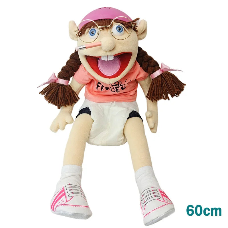 A realistic plush hand puppet with pink hair and glasses, wearing a pink shirt and white shorts.