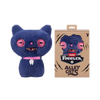 A dark blue plush toy of a cat with pink eyes and a white tooth, displayed next to its packaging.