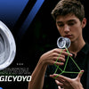 A young man is demonstrating a crystal plastic yo-yo, with various features listed on the side.