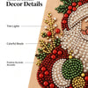 Christmas decor details showing various colored beads and lights arranged in a festive design on a painting frame