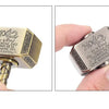 A close-up view of a hammer-shaped metal fidget spinner with engraved text and a removable pin.