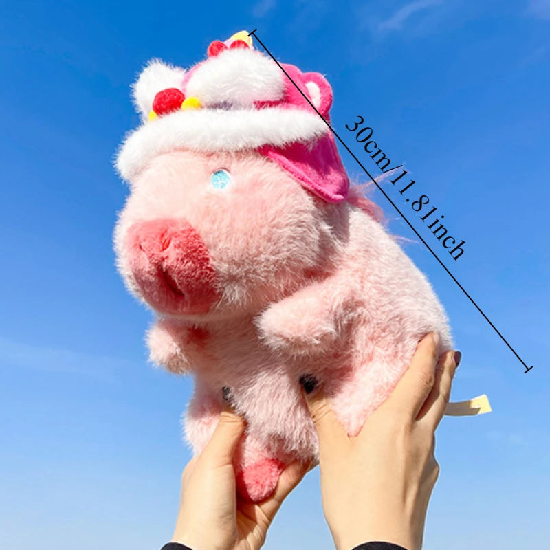 A pink capybara plush toy, representing a mother with four babies, is held up against a blue sky.