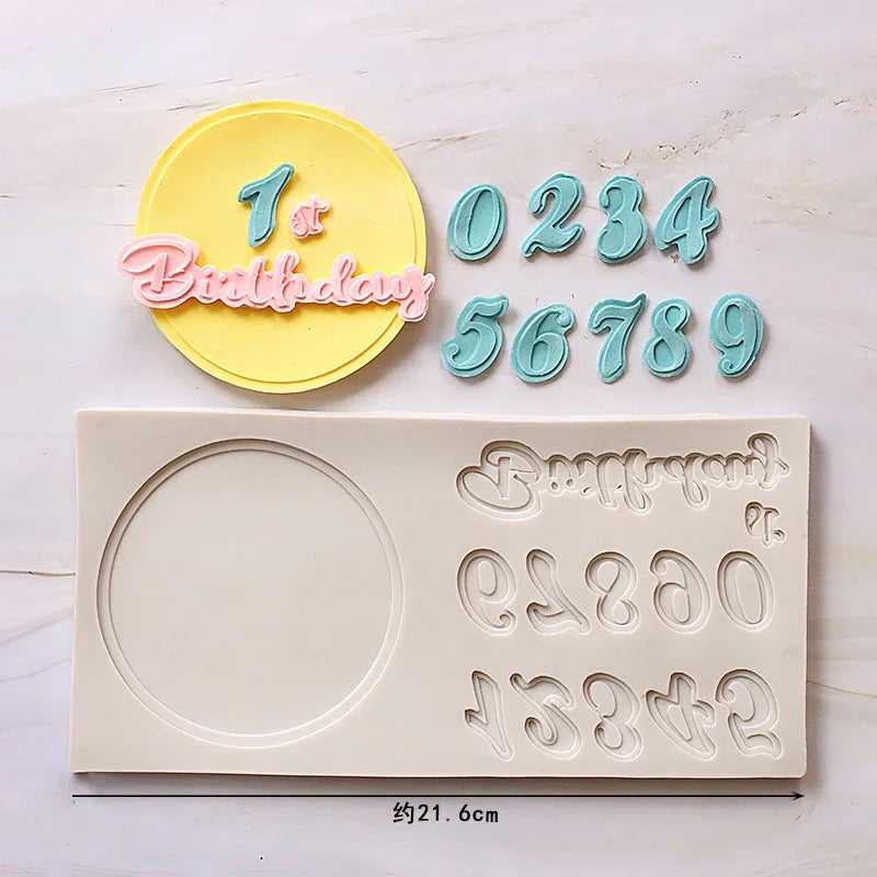 A set of silicone cake molds featuring a yellow circle with the number one and pink text, alongside individual numbers and a 