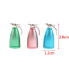 Three miniature alloy kettles in green, pink, and blue for dollhouse kitchen decor.